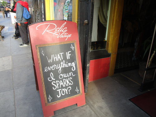A sign outside of Relic Vintage says "What if everything I own SPARKS JOY"